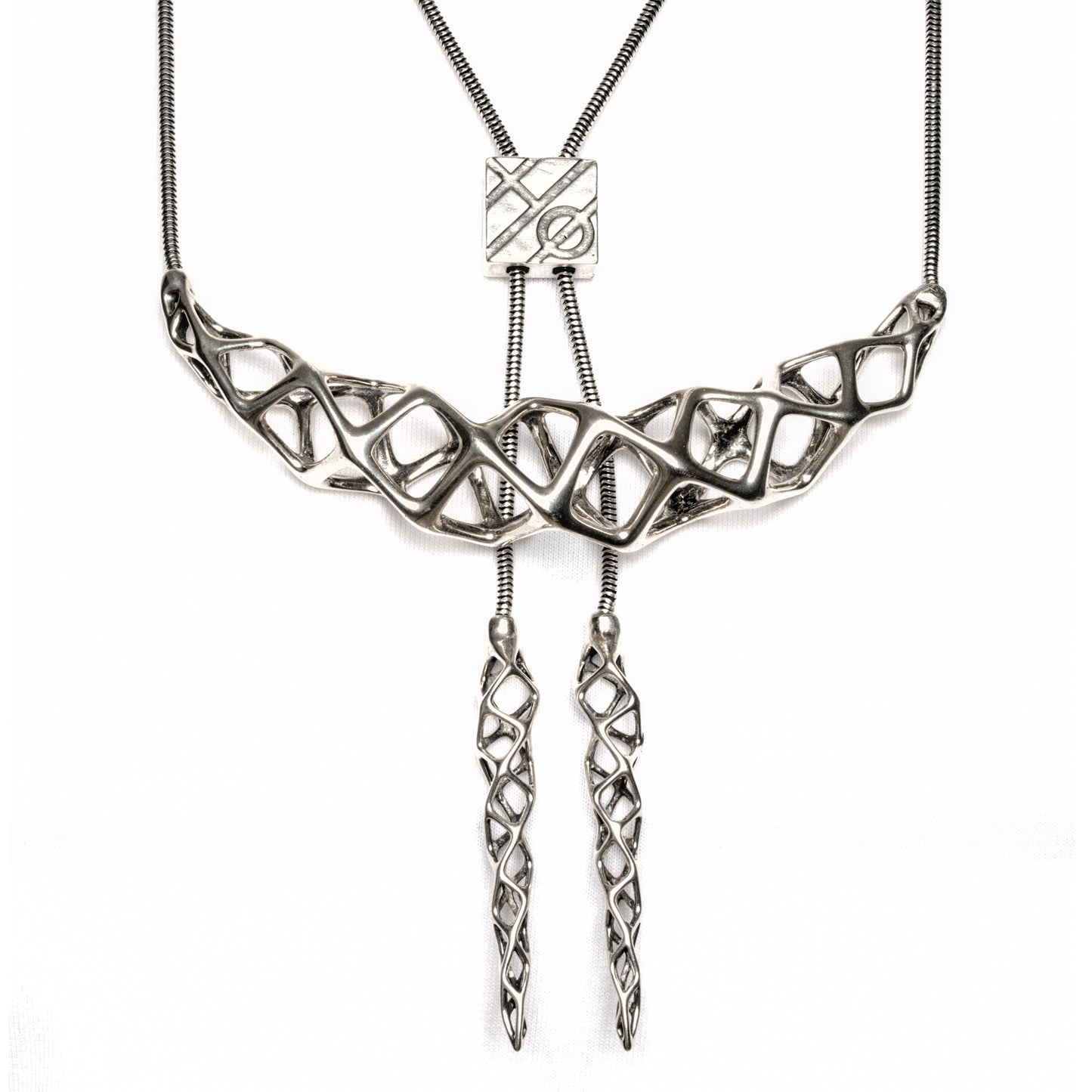 This solid sterling silver necklace is an original Xover0 jewelry concept. It is a hybrid between a bolo tie and a choker. Hence the name boker.