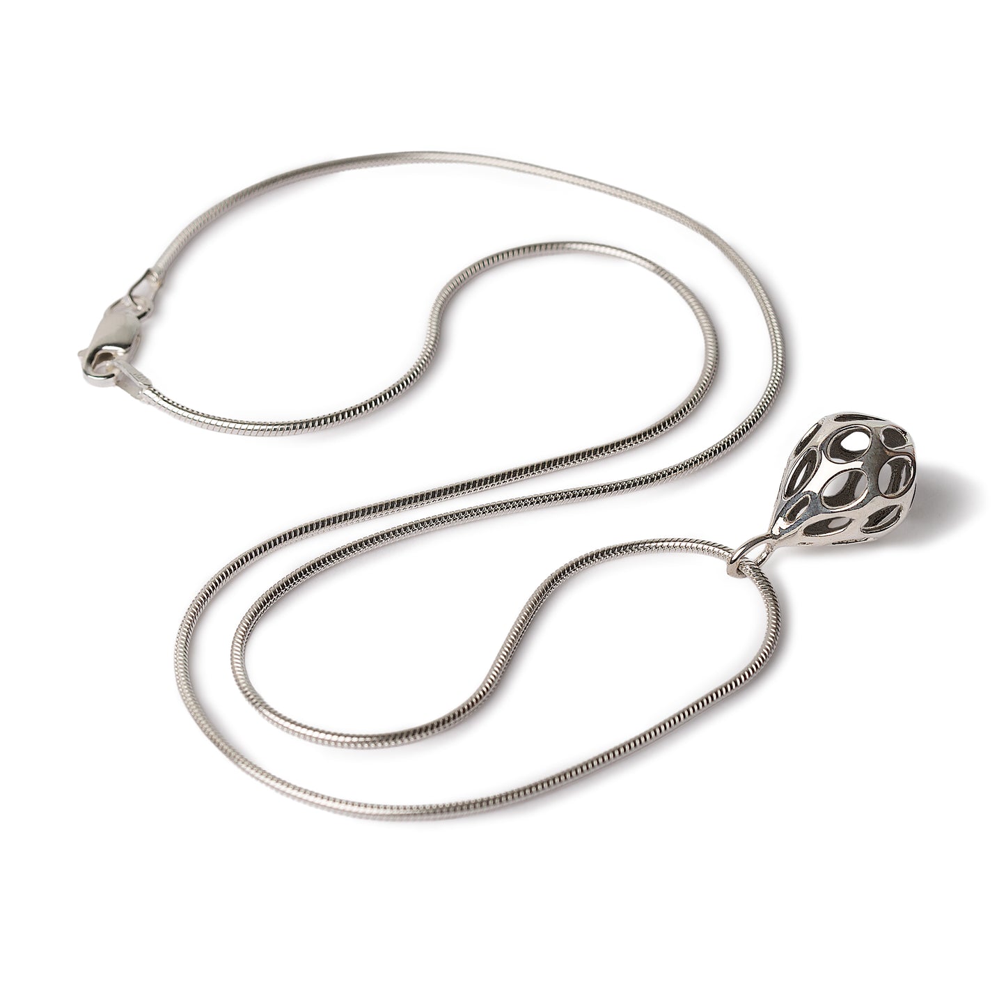 Xover0’s OLEA pendant necklace in solid sterling silver features a teardrop-shaped volume pierced with oval cutouts on an 18-inch snake chain secured by a lobster clasp. The necklace is displayed here in full on a white background.