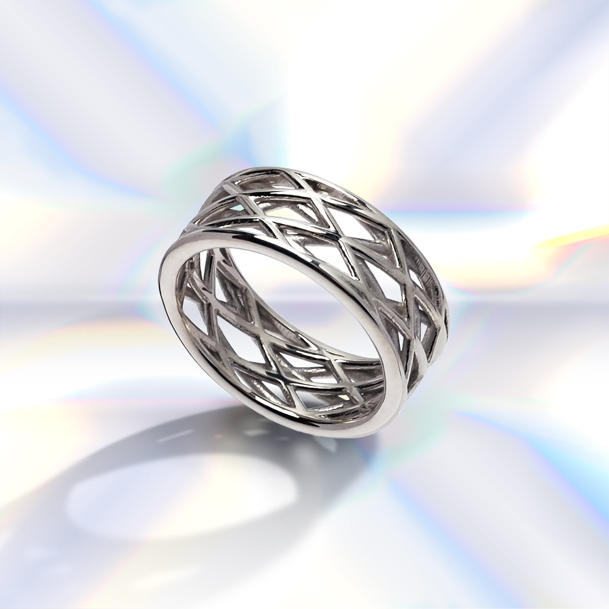Futuristic looking sterling silver ring band with layered latticework filigree.