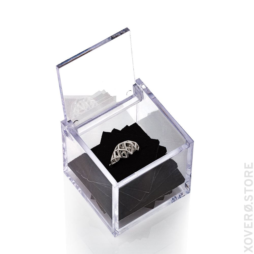 Sterling silver architectural lattice ring presented in clear box with custom laser cut neoprene insert.
