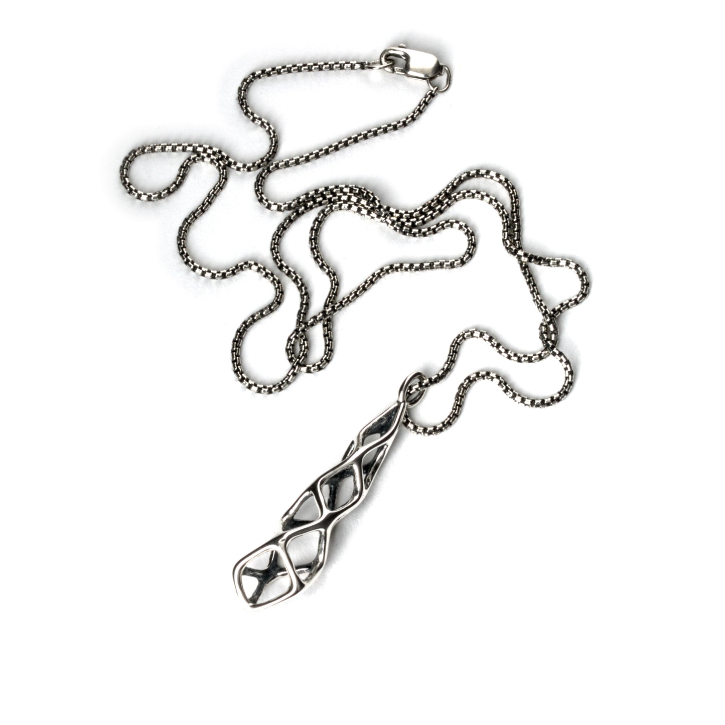 The contrast oxidized solid sterling pendant is suspended from a matching box chain and finished with a lobster clasp. 