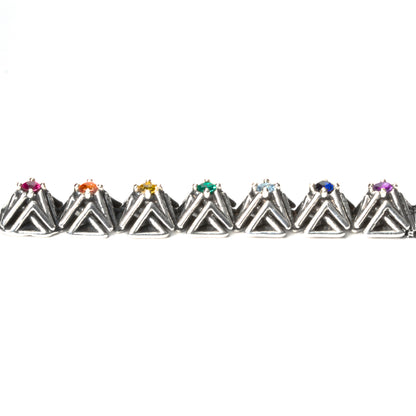 Side view of the solid .925 bar pendant with rainbow gemstones. This photo shows the dimension of the complex stud settings. Each pyramid spike is approximately 1x1x1  cm. 