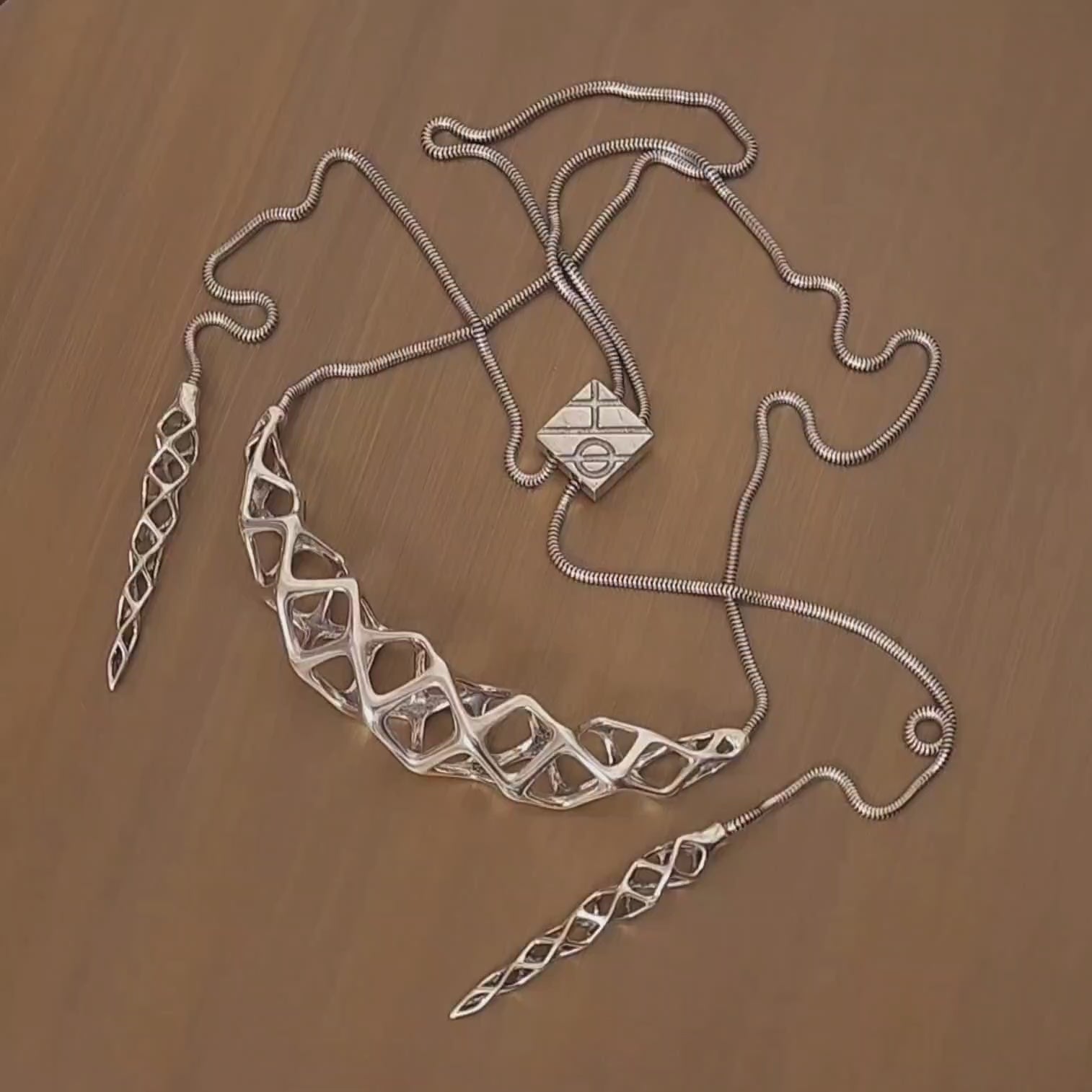 Our combination bolo-tie / choker necklace is shown from all angles on a turn table in this video. 