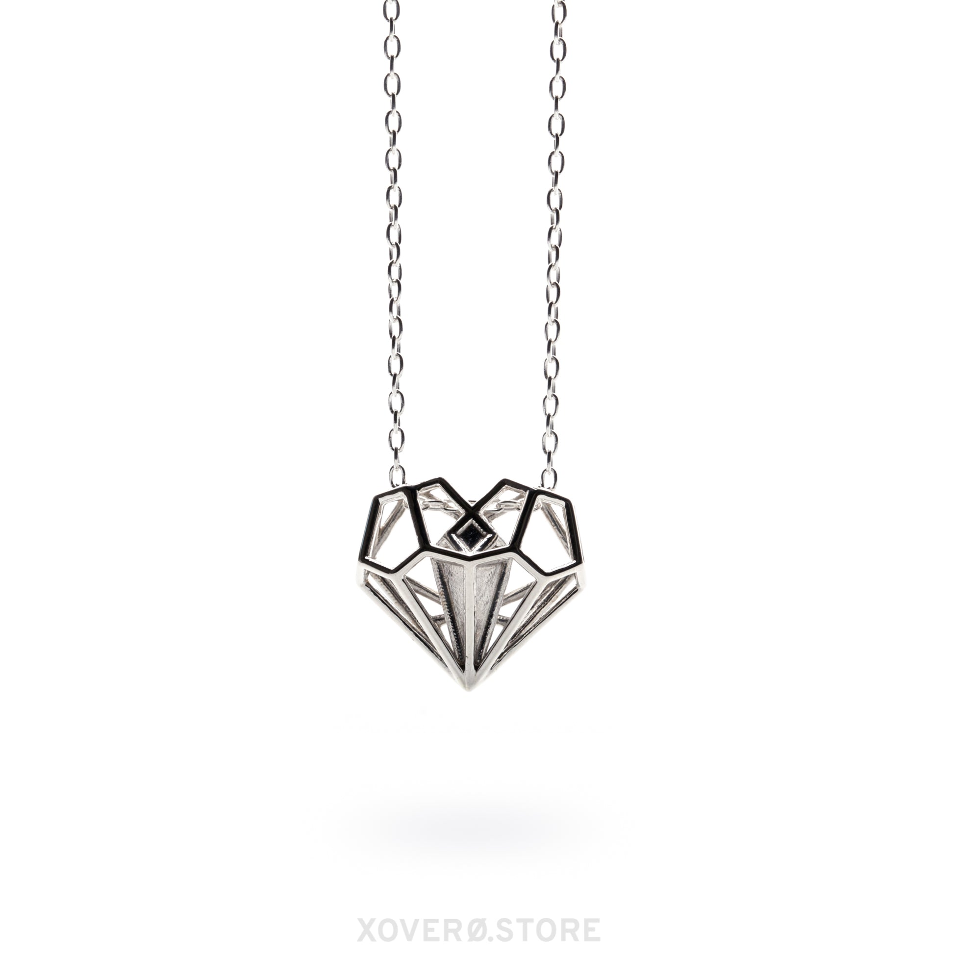 The Geoheart Pendant necklace from the Netflix movie Uglies, worn by Joey King as Tally Youngblood. This solid .925 sterling silver (or 18k gold) heart pendant, designed by Xover0 Jewelry, takes a futuristic approach to Art Deco architecture. The iconic, heirloom-quality design is prominently featured as part of the storyline in Uglies.